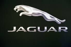Jaguar logo featuring a silver leaping jaguar above the Jaguar text on a dark background